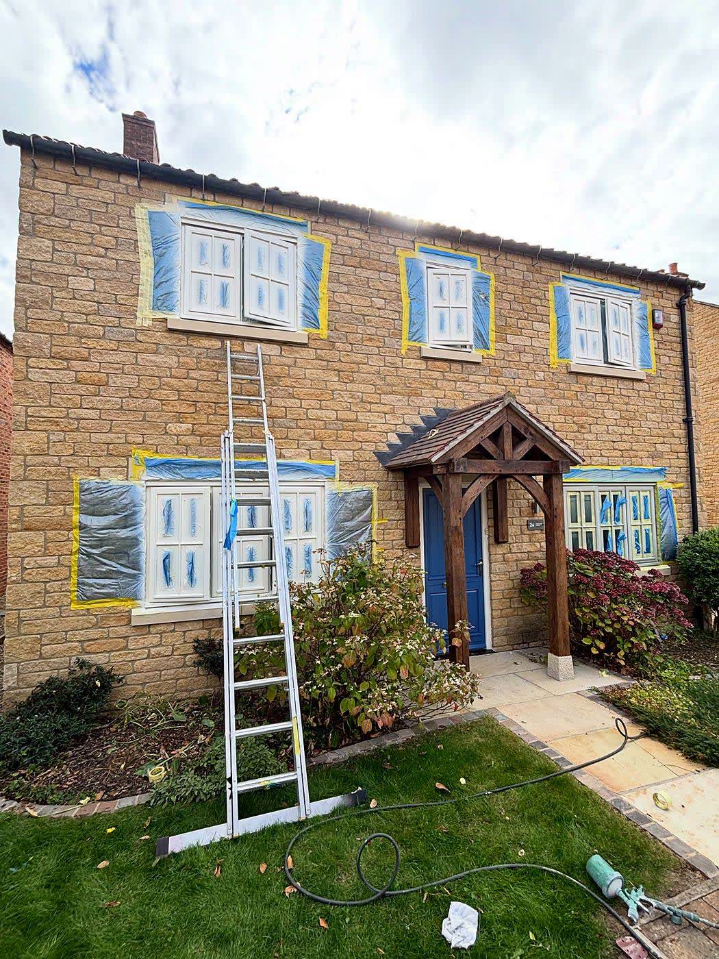 Before: house masked up during spraying