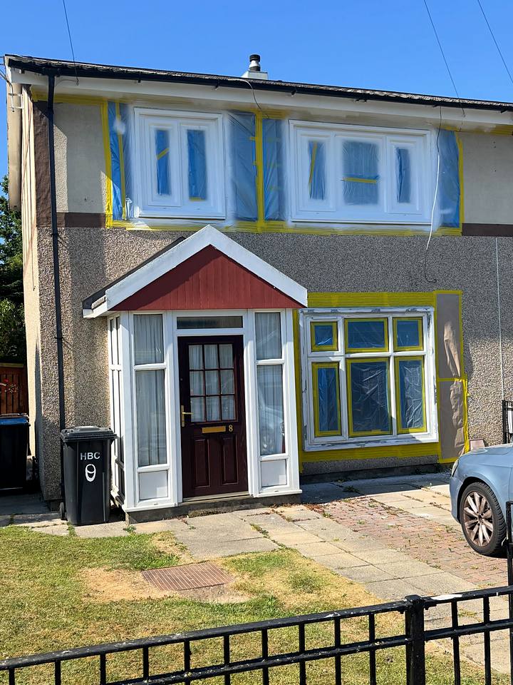Whole house masked for a full exterior spray in Selemix brilliant white