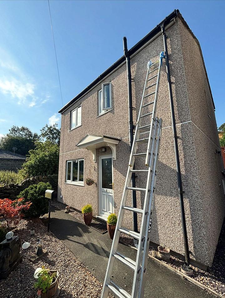 Rendered house with ladder up for an exterior respray
